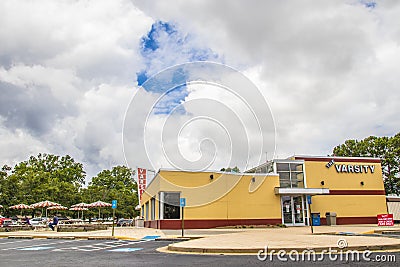 The Varsity of Gwinnett and a customer eating side view Editorial Stock Photo