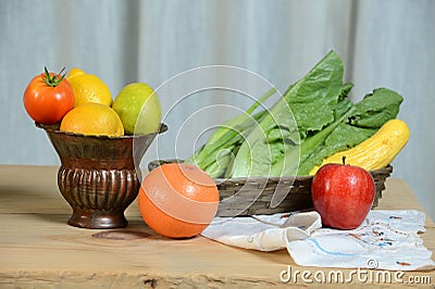 Vase and Basket With Produce Stock Photo