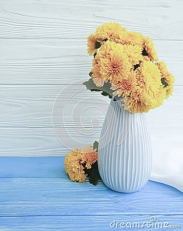 Vase bouquet vintage plant yellow chrysanthemum home elegance celebration on a wooden background, autumn blossom Stock Photo