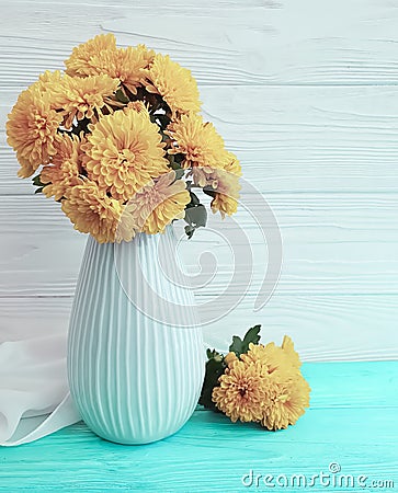 Vase bouquet yellow chrysanthemum home elegance celebration on a wooden background, autumn blossom Stock Photo