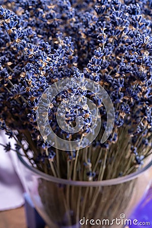 Vase with bunch of purple dried aromatic lavender flowers in gift shop in Provence, France Stock Photo