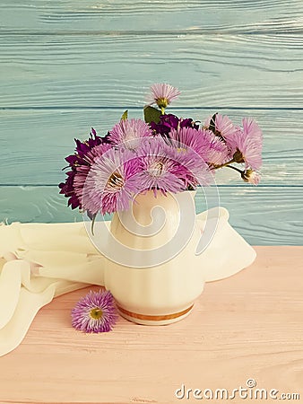 Vase flowers bell, purple elegance beauty decorative spring chrysanthemum arrangement on a wooden background Stock Photo