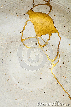 A kintsugi repaired bowl with gold. Stock Photo