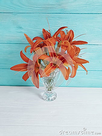 Vase orange lily celebration on a wooden background Stock Photo