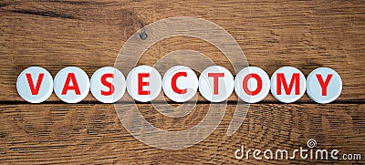 Vasectomy symbol. Concept words Vasectomy on white circles. Beautiful wooden table wooden background. Medical and vasectomy Stock Photo