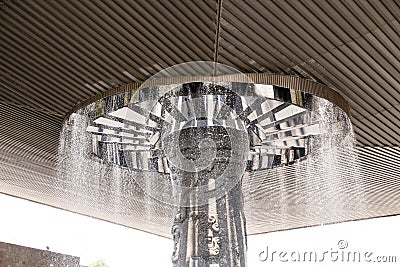 A vast square concrete umbrella of cascading water. The plaza of the Museo Nacional de AntropologÃ­a Editorial Stock Photo