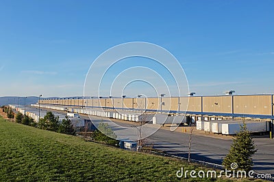 Vast Warehouse and Tractor Trailers Stock Photo