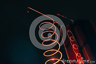 Vat and metallic spiral of alcohol machine red illuminated Stock Photo