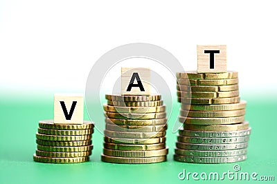 VAT or Value added tax on stack of coins suggesting tax increase Stock Photo