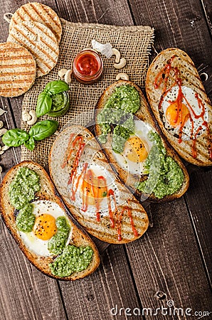 Vatiations of fried eggs inside bread Stock Photo