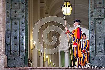 VATICAN CITY, ITALY - MARCH 1, 2014 : A member of the Pontifical Swiss Guard, Vatican. Editorial Stock Photo