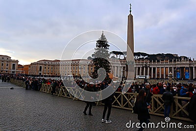 Vatican, Jan. 2, 2023: Queue of people waiting to enter at St. Peter's Basilica to see the body of Pope Benedict XVI Editorial Stock Photo
