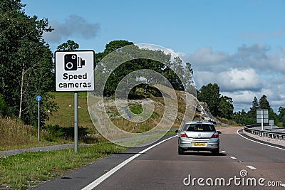 Vauxhall Astra car at Scottish highway with a speed cameras traffic sign warning Editorial Stock Photo