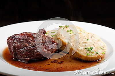 Veal fillet with rich sauce and bread dumplings Stock Photo