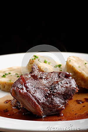 Veal fillet with rich sauce and bread dumplings Stock Photo