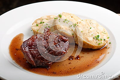 Veal fillet with rich sauce and bread dumplings Stock Photo