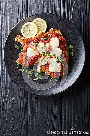 Veal Milanesa Napolitana with mozzarella cheese and tomato sauce Stock Photo