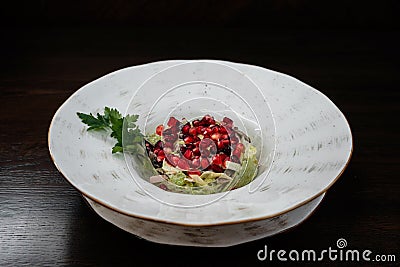 Veal tongue salad with fresh pomegranate. Useful diet lunch. Beautiful portion of food in the cafe. Stock Photo