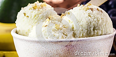 vegan banana ice cream made with frozen bananas and tropical fruits in the background, without adding chemicals. Healthy dessert Stock Photo