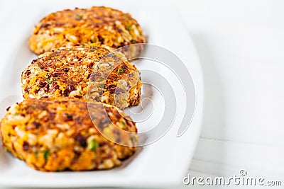 Vegan bean rice burgers cutlets on white dish Stock Photo
