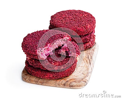Vegan beetroot and bean burgers on wooden board isolated on white Stock Photo