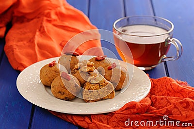 Vegan besan laddu and black tea on deep blue table Stock Photo