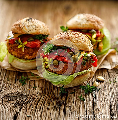 Vegan burgers, Pumpkin burgers with the addition of grilled peppers, lettuce, fresh herbs and capers Stock Photo