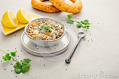 Vegan chickpea hummus spread with lemon and bagel Stock Photo