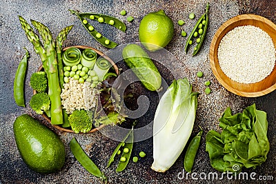 Vegan, detox green Buddha bowl recipe with quinoa, cucumber, broccoli, asparagus and sweet peas. Stock Photo
