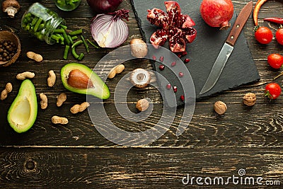 Vegan food, detox, avocado, fruit, green beans, broccoli, nuts and mushrooms. Diet and healthy food, vitamins and sports. Flat-lay Stock Photo