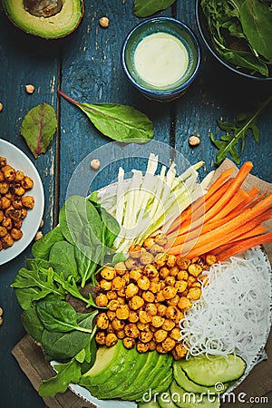 Vegan food, fried chickpeas, rice noodles with wegetables Stock Photo
