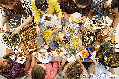 Vegan friends eating healthy dinner Stock Photo