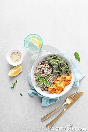 Vegan healthy lunch bowl with quinoa, sauteed kale and baked butternut squash Stock Photo