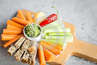 Vegan healthy snacks: guacamole, carrots, celery Stock Photo