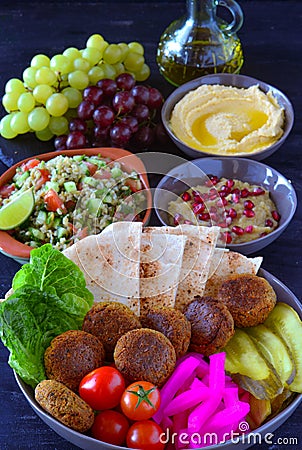Vegan mediterranean lunch platter with olive oil jug Stock Photo