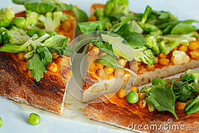 Vegan pizza with chickpeas and broccoli. Stock Photo
