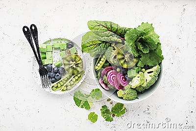 Vegan power bowl. Vegetables fruits green leafy vegetables for a healthy snack. Top View Stock Photo