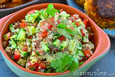 Vegan quinoa salad served in earthen bowl Stock Photo