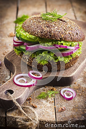 Vegan rye burger with fresh vegetables Stock Photo