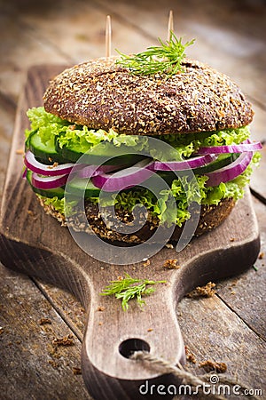 Vegan rye burger with fresh vegetables Stock Photo