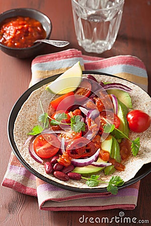 Vegan taco with avocado tomato kidney beans and salsa Stock Photo