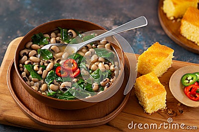 Vegan US southern black-eye peas and collard greens with corn bread Stock Photo