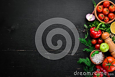 Vegetable background. Fresh tomatoes, paprika, onions and parsley on the table. Stock Photo