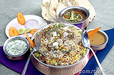 Vegetable biryani, eggplant curry,tandoori roti, Stock Photo