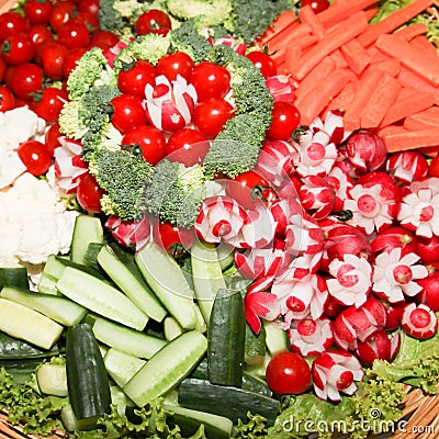 Large vegetable buffet with carrots, radishes and small cherry tomatoes Stock Photo