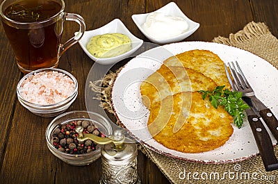 Vegetable rosti, golden fried potato pancakes with dips from cauliflower and sour cream Stock Photo