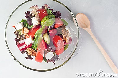 Vegetable salad with feta cheese in a glass dish Stock Photo