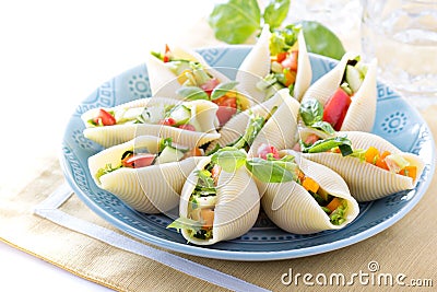 Vegetable salad served in pasta shells Stock Photo