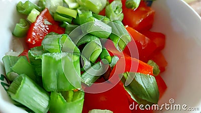 Vegetable salad in a white bowl, close-up. Mediterranean food. Stock Photo