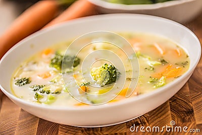 Vegetable soup from broccoli carrot onion and other ingredients. Healthy vegetarian food and meals Stock Photo